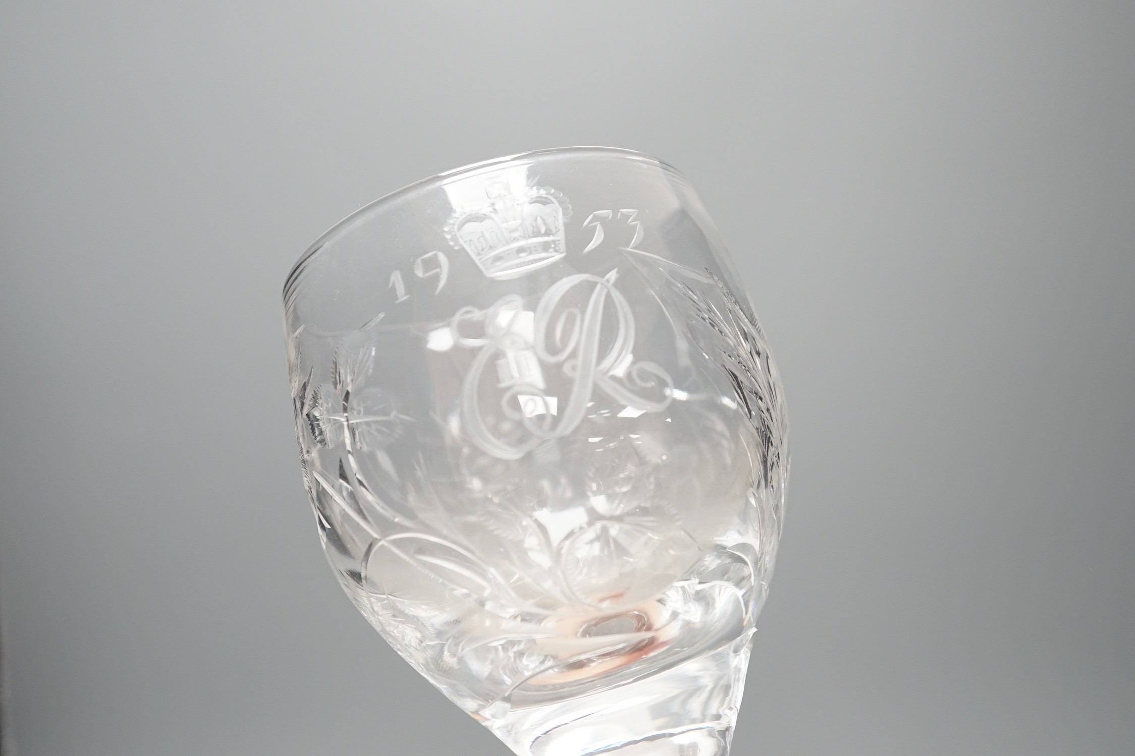 A set of four commemorative 1953 ER II coronation etched wine goblets, 14cms high